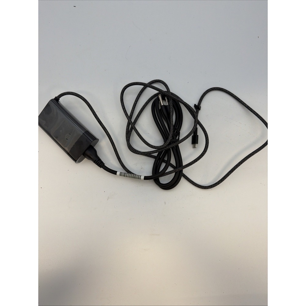 genuine HP 65W USB-C AC adapter.